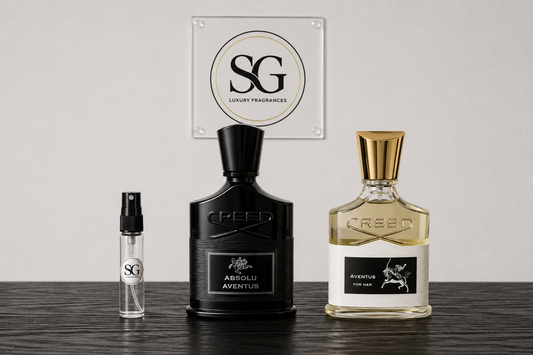 Two Creed perfume bottles on a wooden surface with a white background featuring the Creed logo.