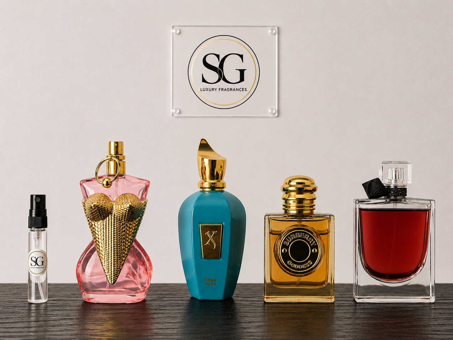 Collection of perfume bottles with 'SG Luxury Fragrances' logo in the background