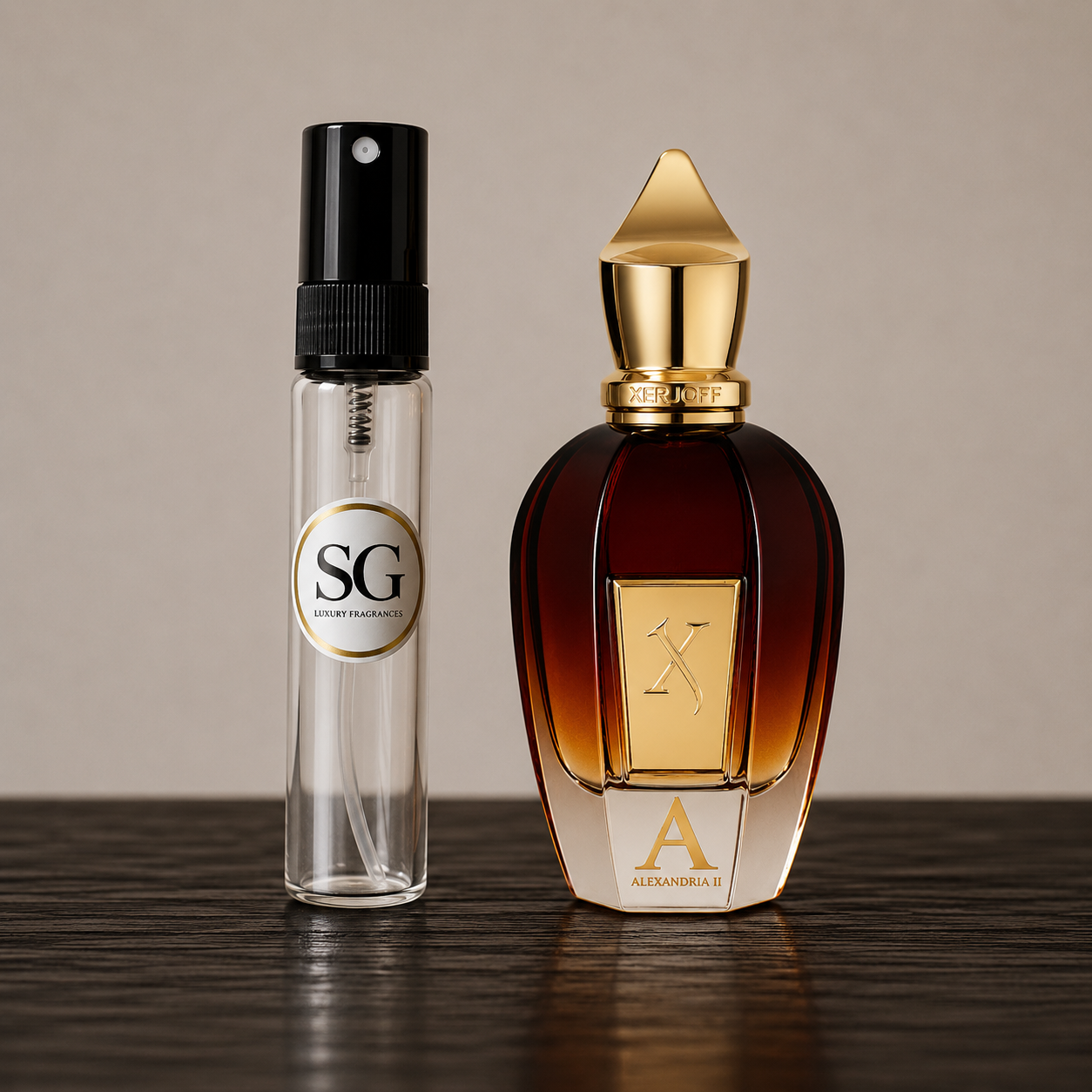 A clear glass perfume sample vial with a black spray top and a circular SG label stands beside a large amber glass perfume bottle with a gold cap and gold front plaque. Both bottles are placed on a dark wooden surface against a warm beige background.