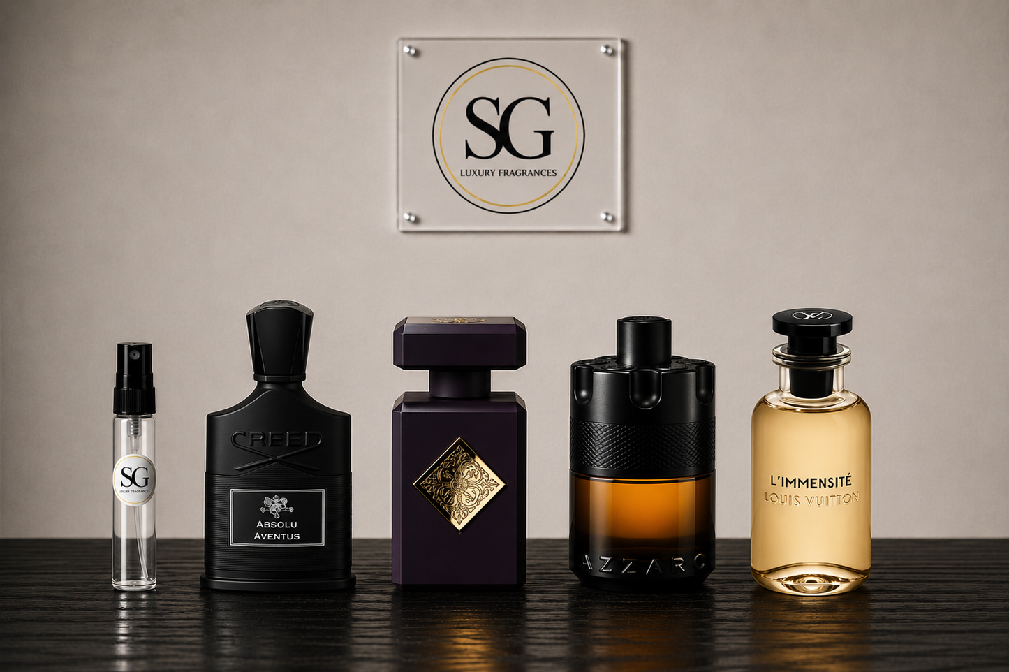 Five luxury fragrance bottles from SG and Azaro arranged on a dark wooden surface against a beige wall, with an SG Luxury Fragrances sign hanging above.