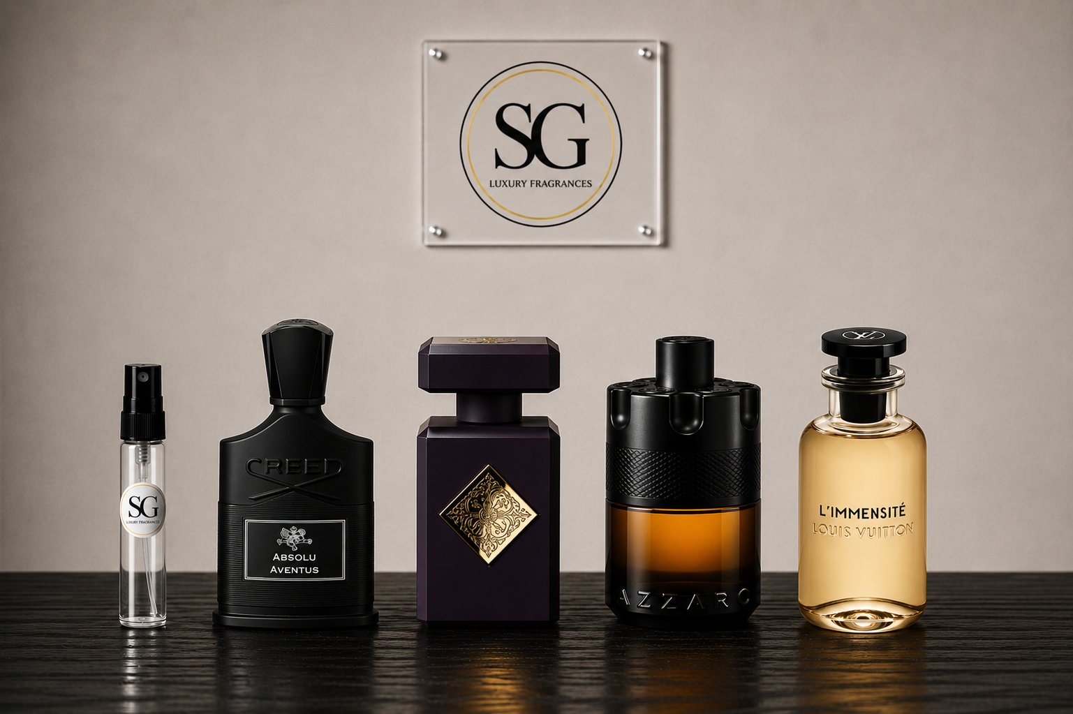 Five luxury fragrance bottles from SG and Azaro arranged on a dark wooden surface against a beige wall, with an SG Luxury Fragrances sign hanging above.