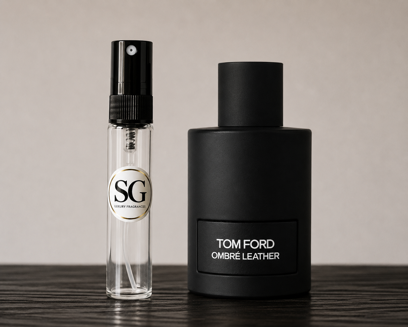 Two perfume bottles, one clear with a black cap and the other black, on a wooden surface.
